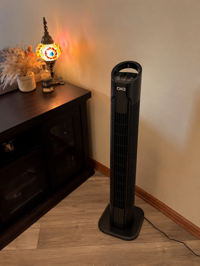 Oxa Tower Fan next to a sideboard in the evening